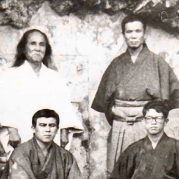 Shuji tasaki next to his teacher Gogen Yamaguchi  during his time with the IKGA 